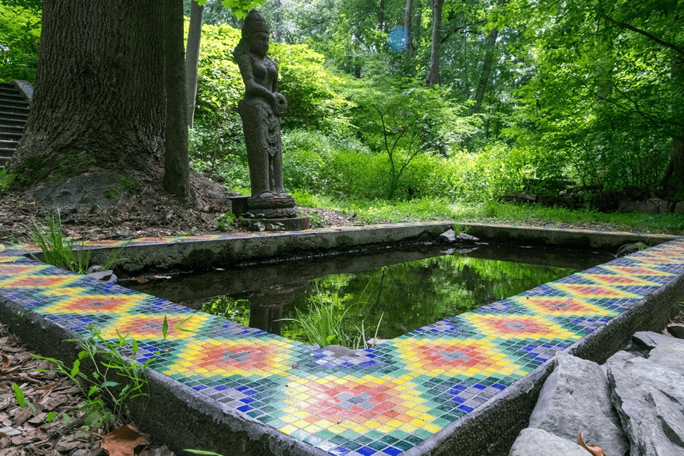 Reflecting pond featuring a mosaic inspired by Allyson Grey's "Order." Mosaic made in collaboration with Allyson Grey, Cory Glory, Vishnu Dass, and Genevieve Wood.